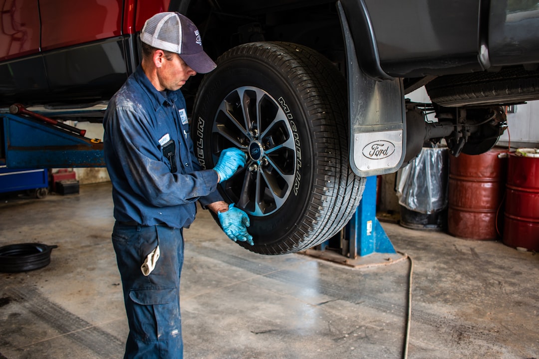 man holding lug wrench